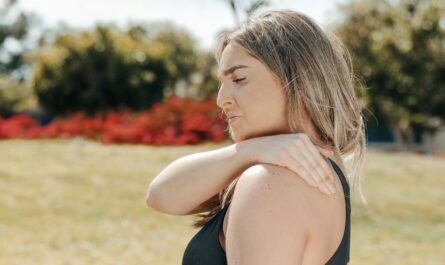 Photo by Kindel Media: https://www.pexels.com/photo/a-woman-in-black-tank-top-touching-her-shoulder-7298390/