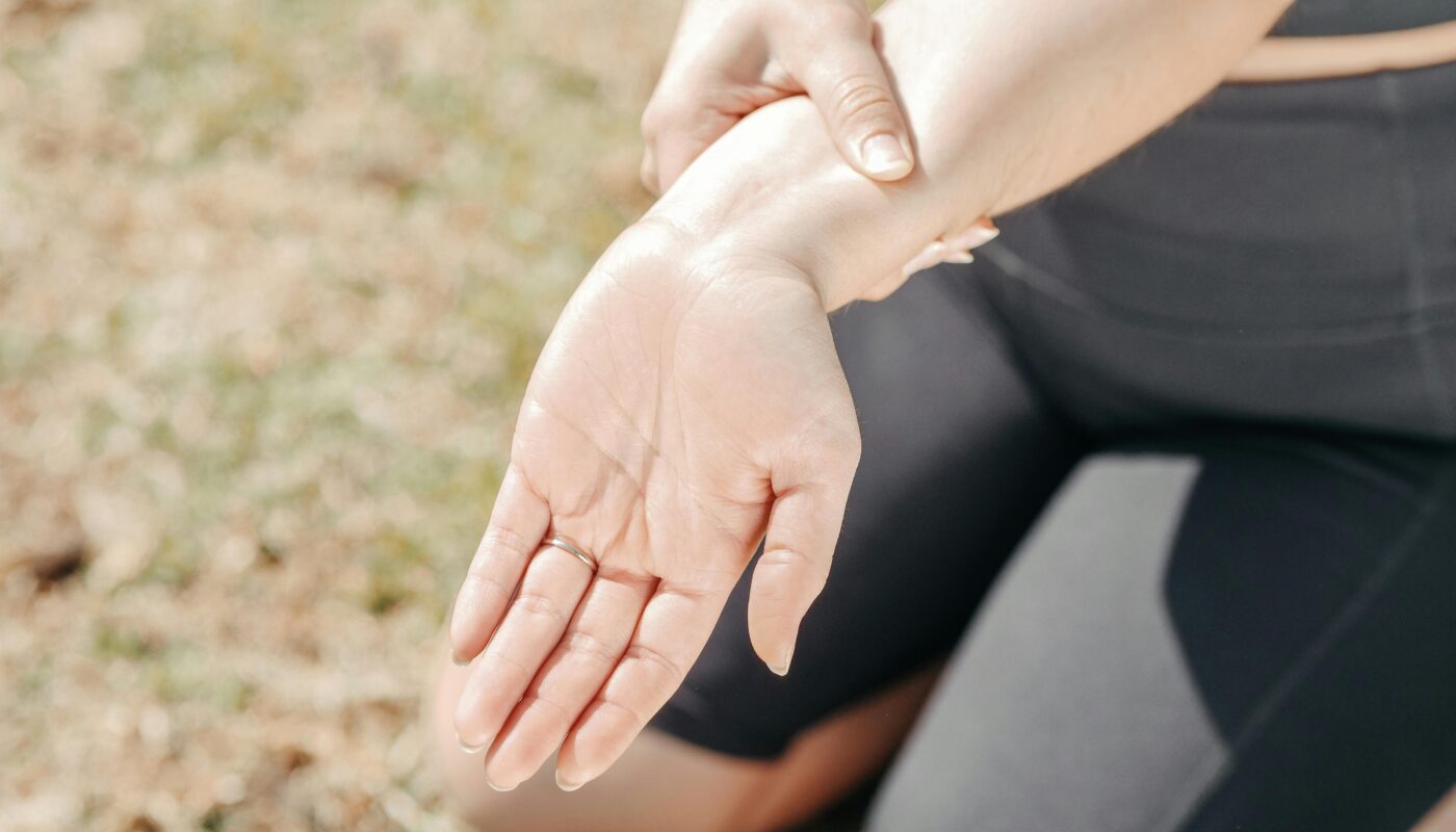 Photo by Kindel Media: https://www.pexels.com/photo/close-up-photo-of-a-woman-stretching-her-wrist-7298399/