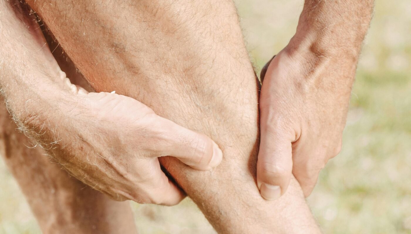 Photo by Kindel Media: https://www.pexels.com/photo/man-massaging-his-calf-muscles-7298421/