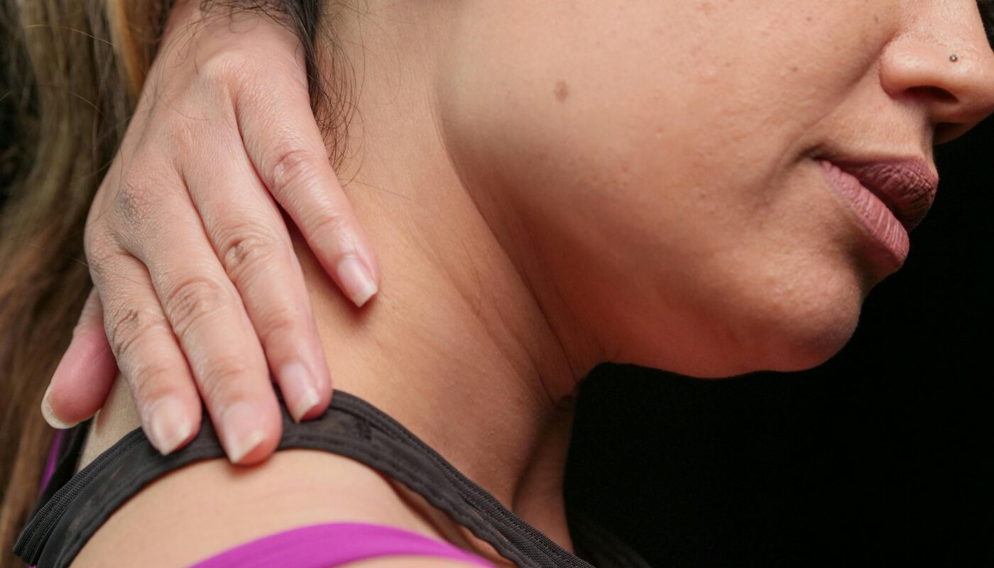 Photo by Kindel Media: https://www.pexels.com/photo/close-up-photo-of-a-woman-having-a-neck-pain-7298846/