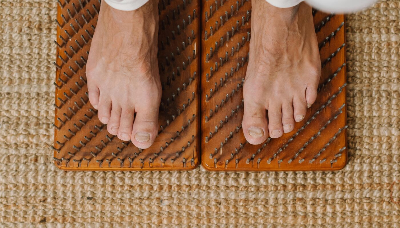 Photo by Mikhail Nilov: https://www.pexels.com/photo/man-practicing-yoga-on-sadhu-board-6945095/