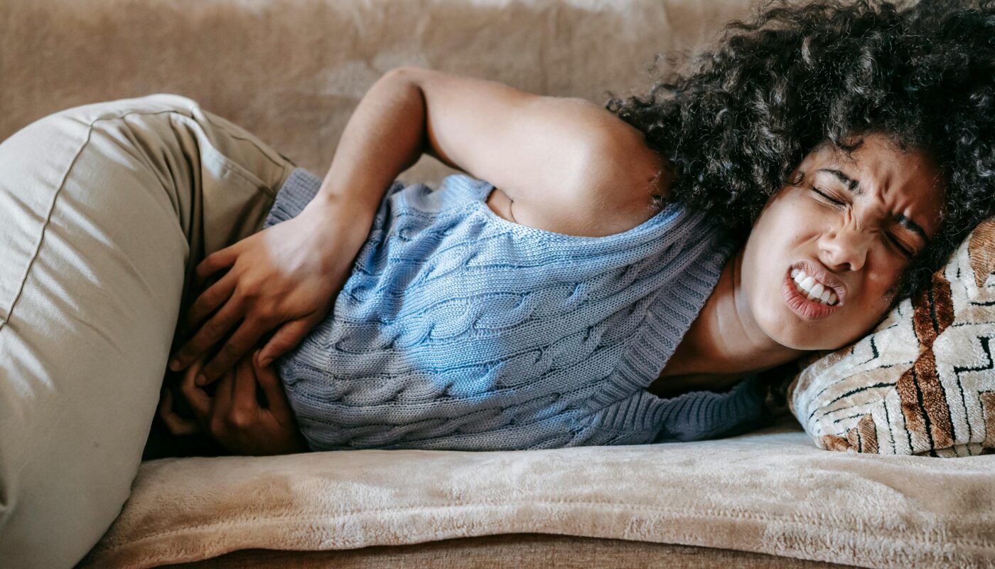 Photo by Sora Shimazaki: https://www.pexels.com/photo/woman-suffering-from-a-stomach-pain-lying-down-on-couch-5938365/