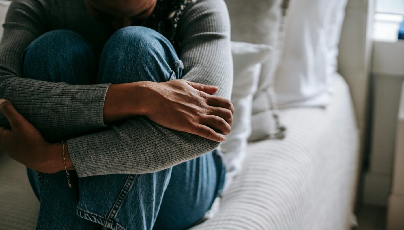 Photo by Alex Green: https://www.pexels.com/photo/crop-pitiful-black-woman-embracing-knees-on-bed-5700205/