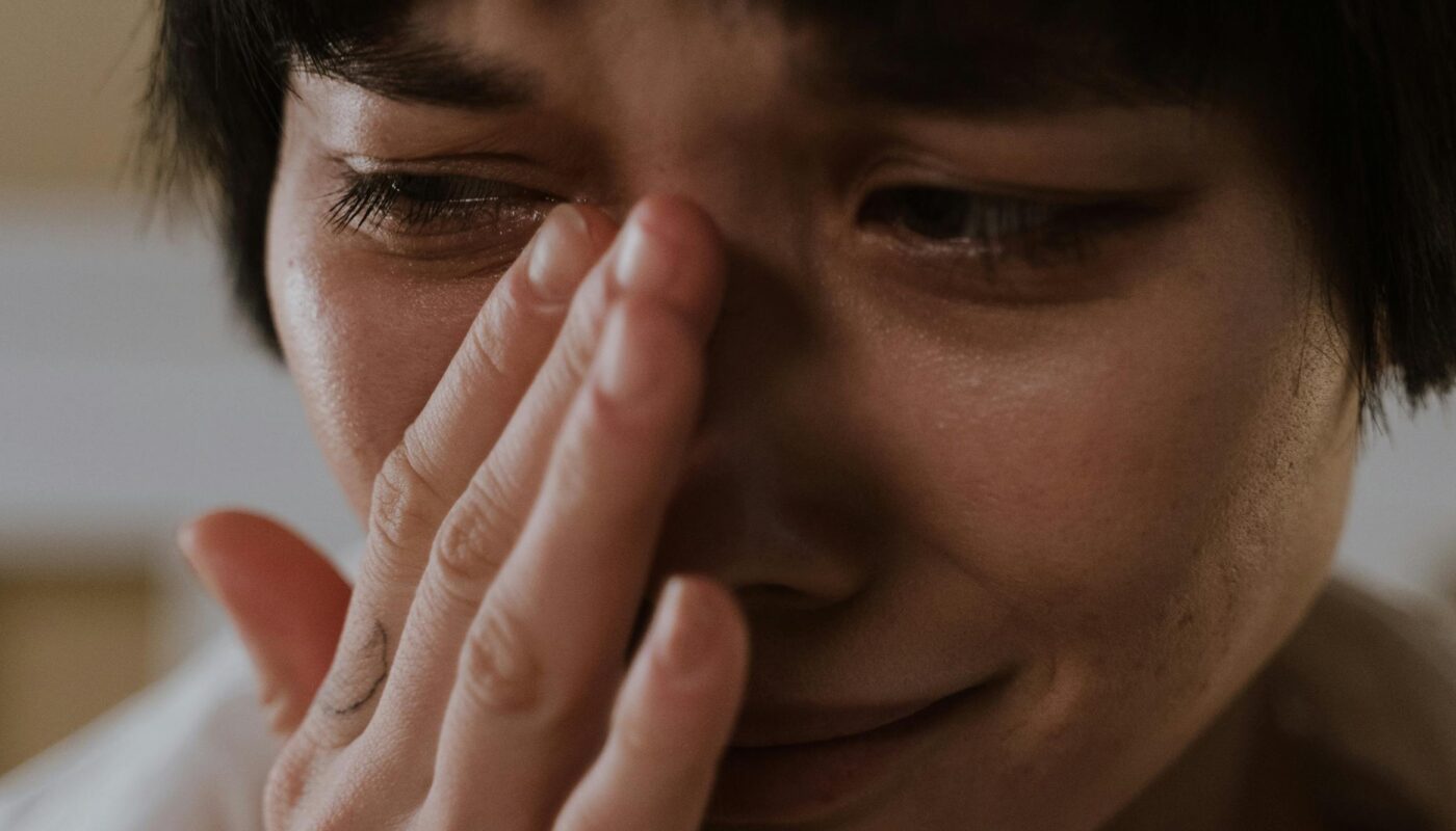 Photo by cottonbro studio: https://www.pexels.com/photo/a-sad-woman-wiping-her-tears-6716238/