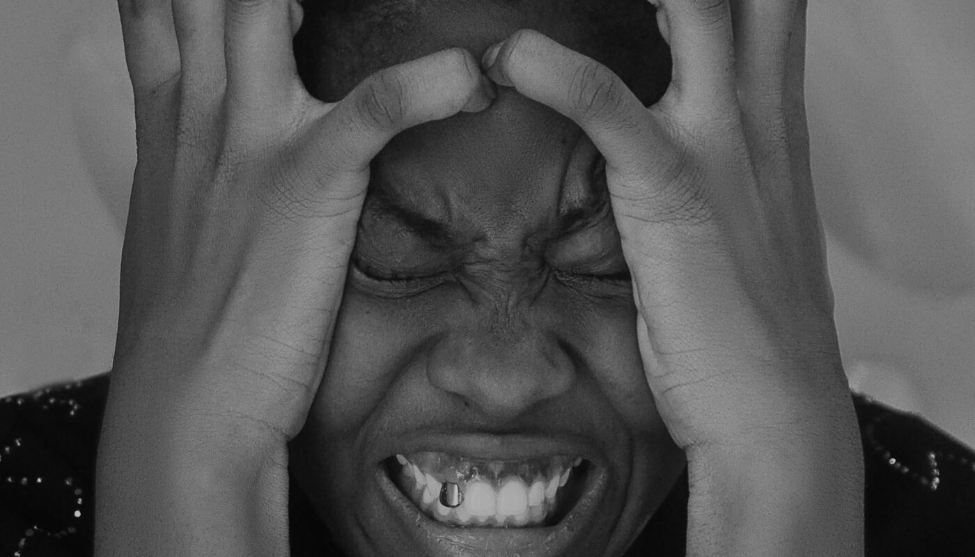 Photo by Oyelakin Jamiu: https://www.pexels.com/photo/man-holding-head-16859965/