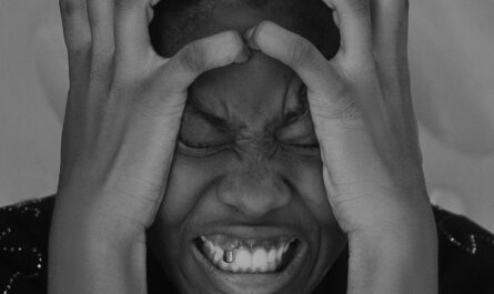 Photo by Oyelakin Jamiu: https://www.pexels.com/photo/man-holding-head-16859965/