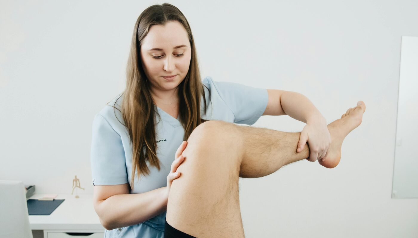 Photo by Funkcinės Terapijos Centras: https://www.pexels.com/photo/physiotherapist-massaging-lifted-leg-20860609/
