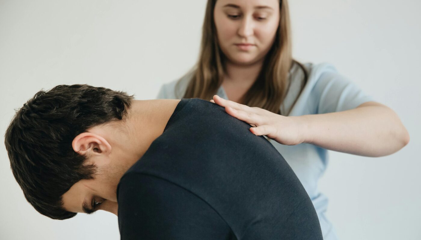 Photo by Funkcinės Terapijos Centras: https://www.pexels.com/photo/physiotherapist-helping-a-patient-exercise-his-back-20860615/