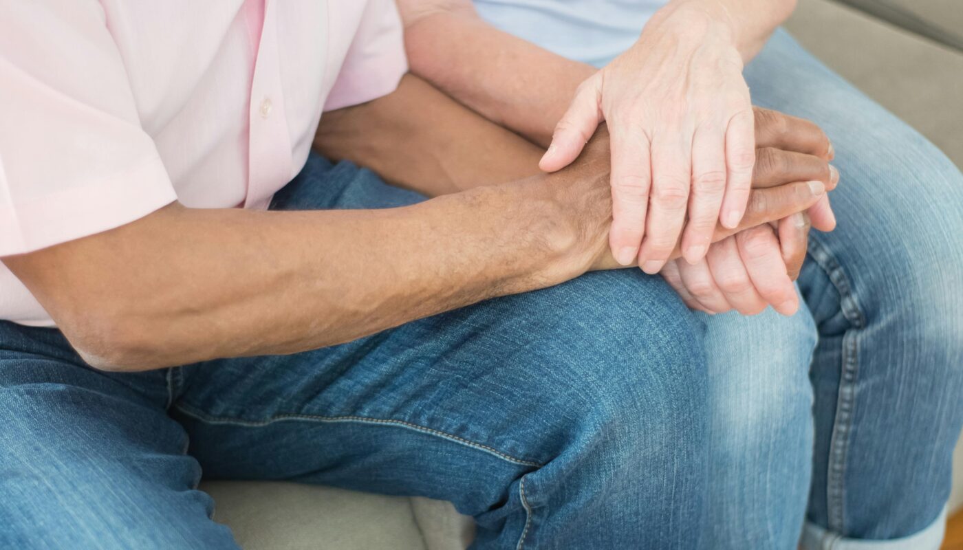 Photo by Kampus Production: https://www.pexels.com/photo/people-holding-hands-while-sitting-on-a-couch-8871436/