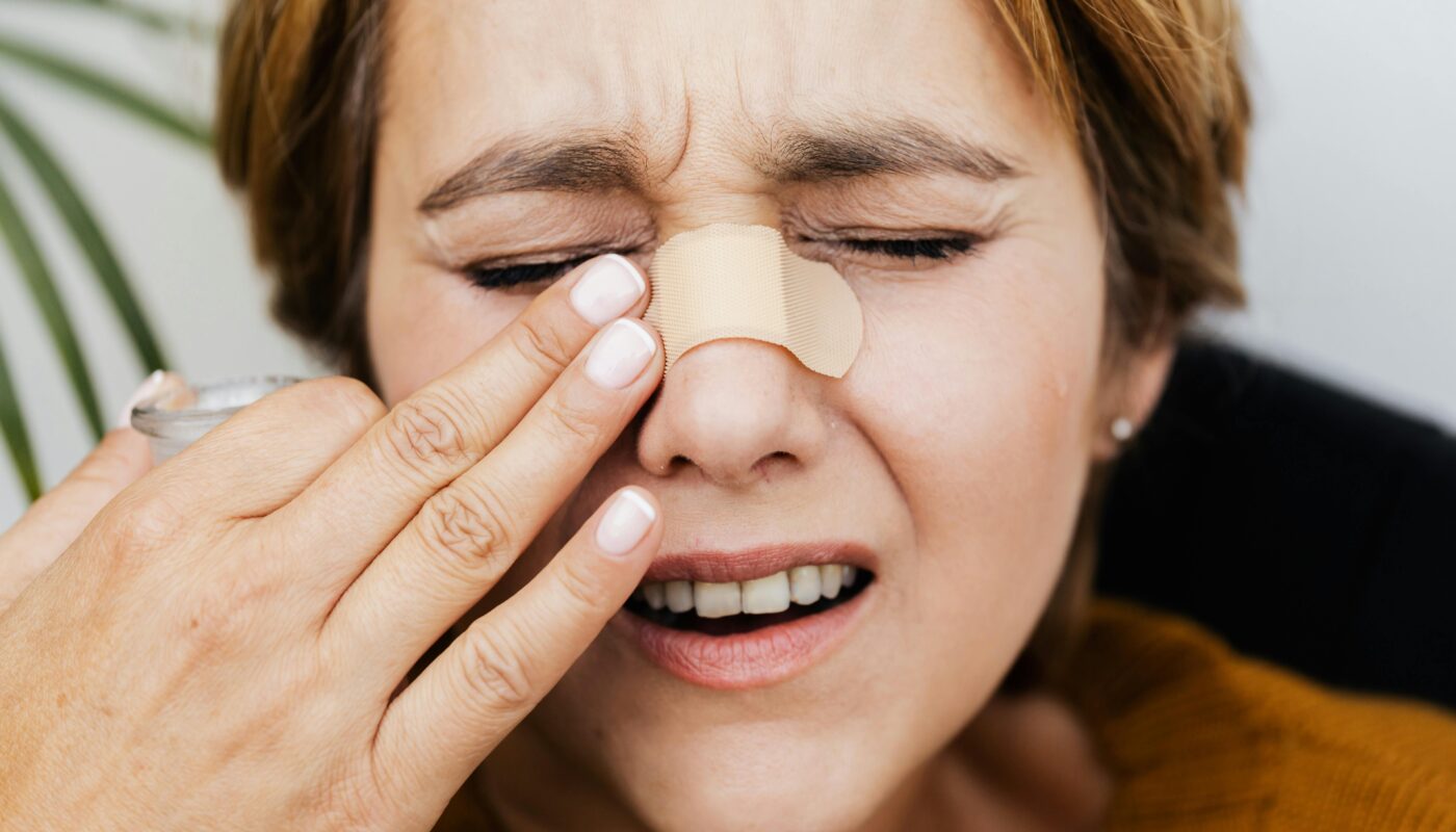 Photo by www.kaboompics.com: https://www.pexels.com/photo/hurt-woman-touching-the-bandage-on-her-nose-5207297/