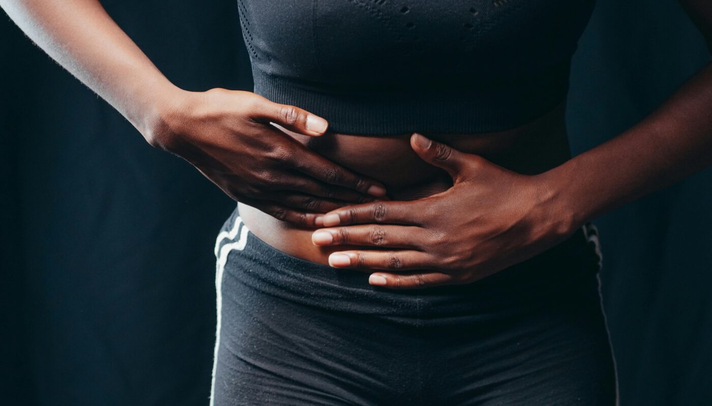 Photo by Kindel Media: https://www.pexels.com/photo/person-wearing-black-active-wear-holding-her-tummy-7298905/