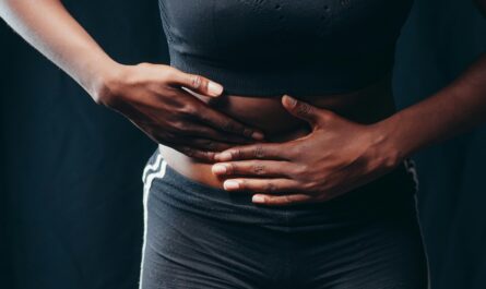 Photo by Kindel Media: https://www.pexels.com/photo/person-wearing-black-active-wear-holding-her-tummy-7298905/