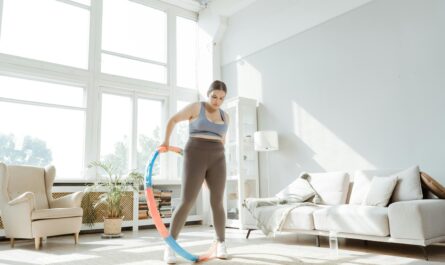 Photo by MART PRODUCTION: https://www.pexels.com/photo/a-woman-using-a-hula-hoop-in-the-living-room-8846459/
