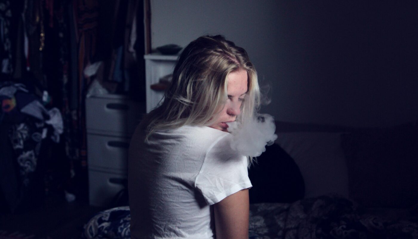 Photo by Alexander Grey: https://www.pexels.com/photo/woman-wearing-white-shirt-sitting-on-sofa-and-smoking-1497232/