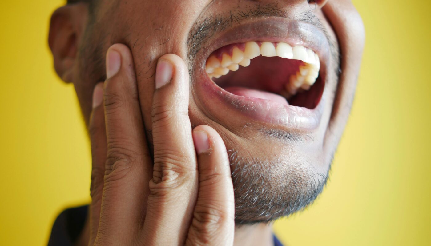 Photo by Towfiqu barbhuiya: https://www.pexels.com/photo/close-up-of-a-man-laughing-14624608/