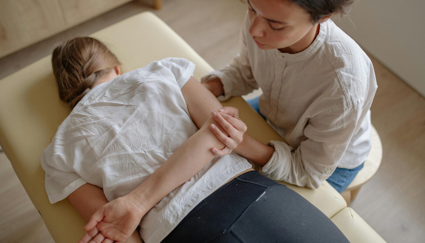 Photo by Yan Krukau: https://www.pexels.com/photo/woman-lying-on-massage-table-having-chiropractic-therapy-5794021/