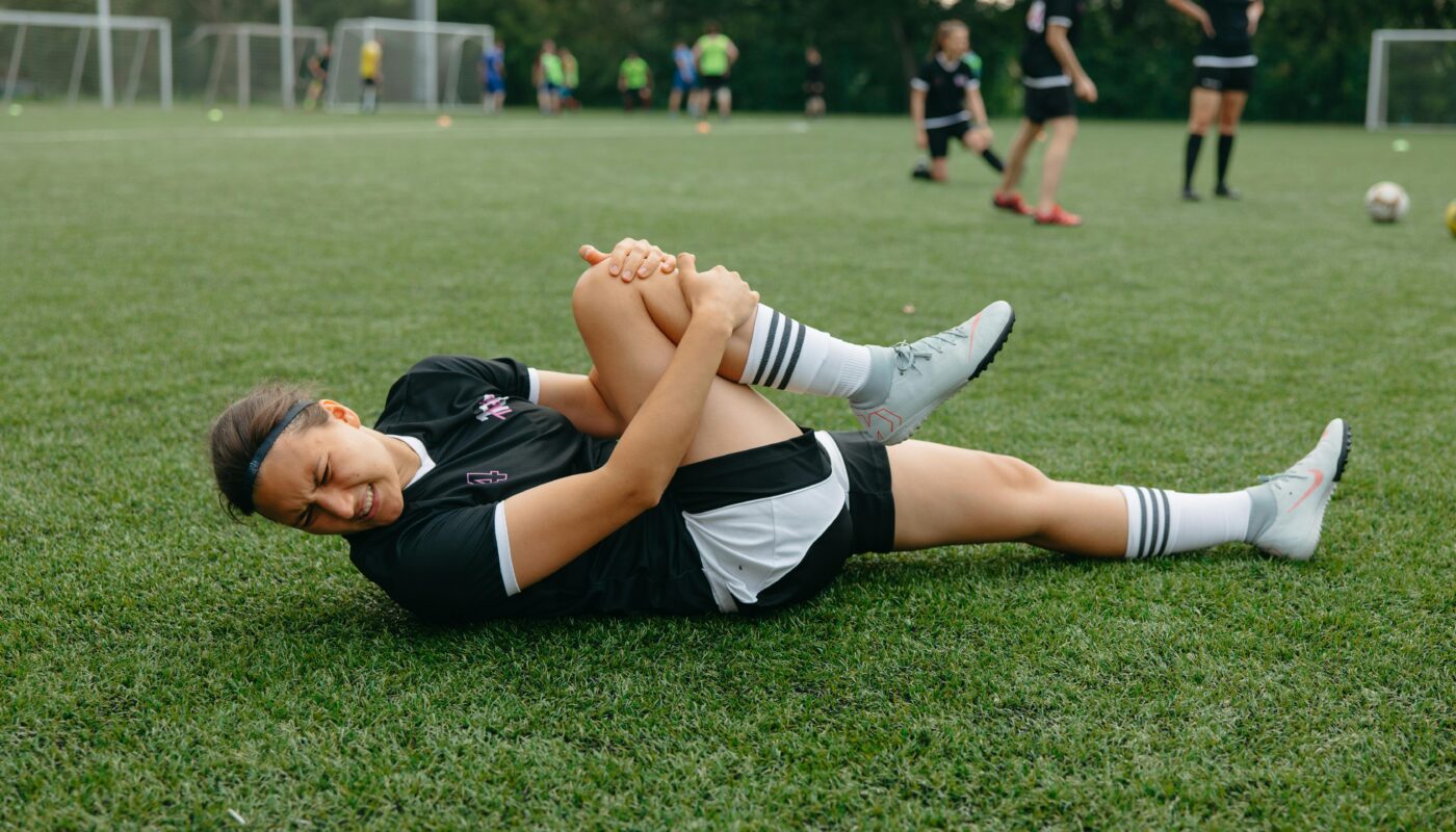 Photo by Anastasia Shuraeva: https://www.pexels.com/photo/injured-athlete-lying-on-a-soccer-field-9517935/