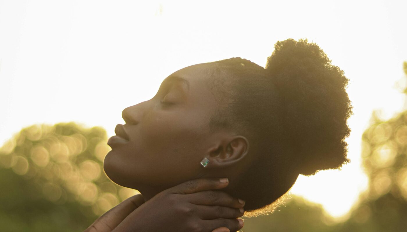 Photo by Charles Awelewa: https://www.pexels.com/photo/peaceful-woman-posing-in-natural-sunlight-outdoors-29676645/