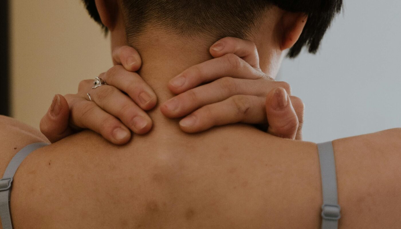 Photo by cottonbro studio: https://www.pexels.com/photo/back-view-of-person-holding-her-neck-6717609/