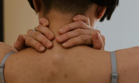 Photo by cottonbro studio: https://www.pexels.com/photo/back-view-of-person-holding-her-neck-6717609/