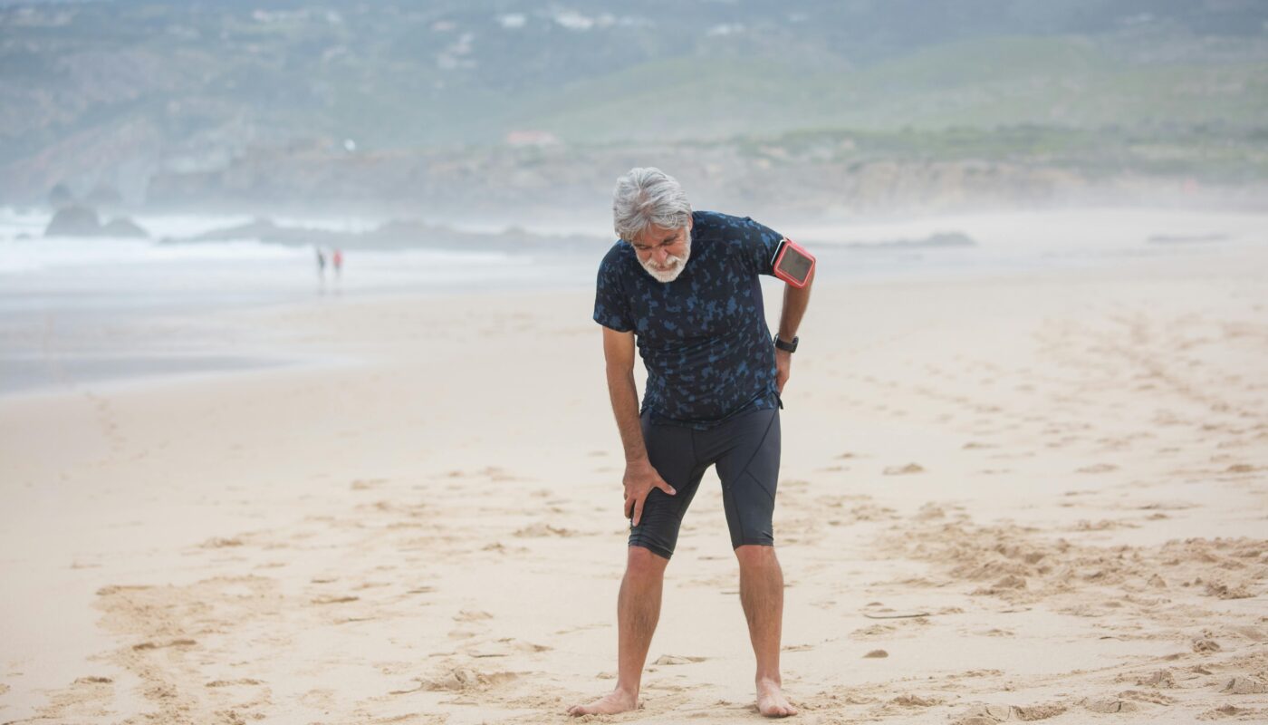 Photo by Kampus Production: https://www.pexels.com/photo/tired-elderly-man-standing-on-the-beach-sand-8638038/