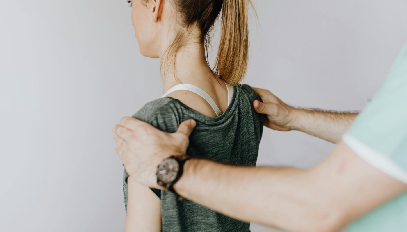 Photo by www.kaboompics.com: https://www.pexels.com/photo/crop-anonymous-osteopath-straightening-shoulders-of-woman-in-doctor-office-4506106/