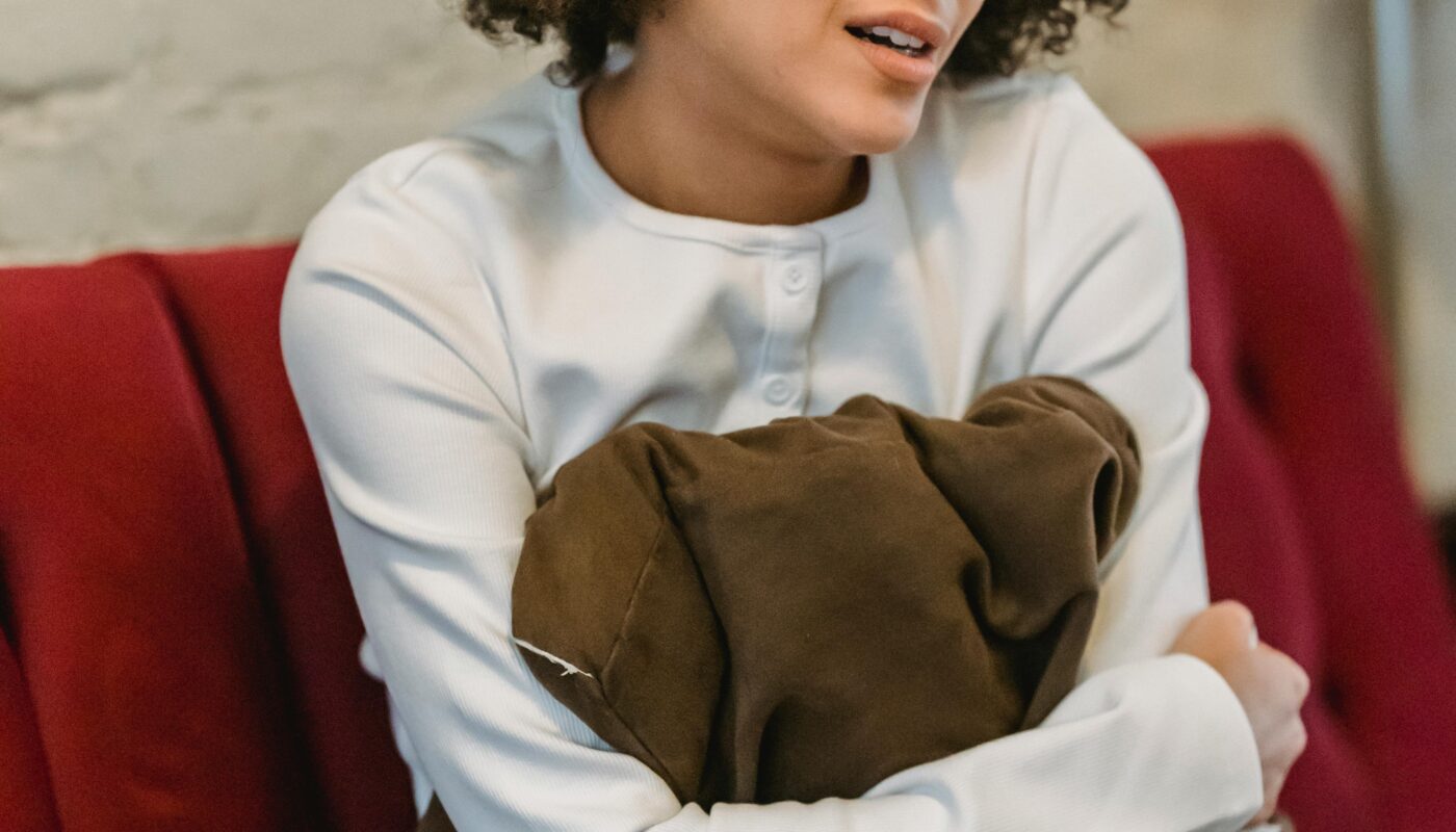 Photo by Liza Summer: https://www.pexels.com/photo/crying-black-woman-sitting-on-couch-6382652/