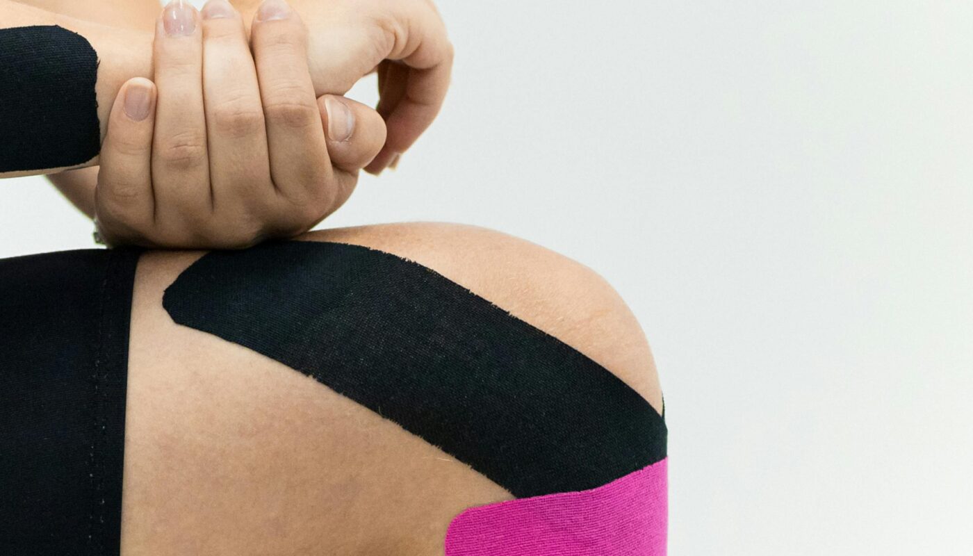 Photo by Maksim Goncharenok: https://www.pexels.com/photo/a-person-with-kinesio-tapes-on-his-knees-6094040/
