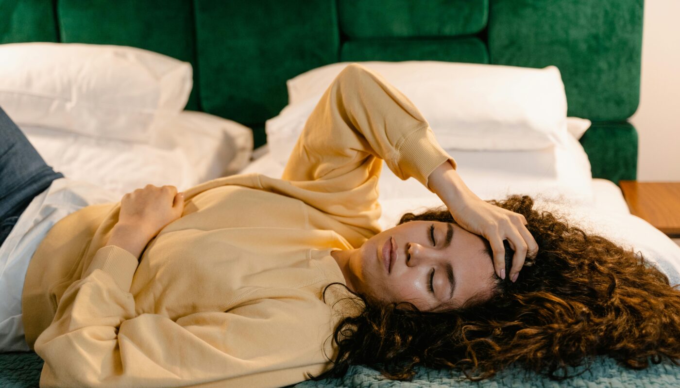 Photo by MART PRODUCTION: https://www.pexels.com/photo/a-woman-in-yellow-sweater-lying-on-bed-7605204/