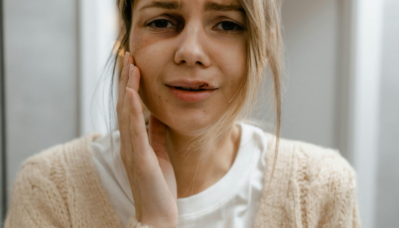 Photo by MART PRODUCTION: https://www.pexels.com/photo/crying-woman-touching-the-bruise-on-her-face-7699302/