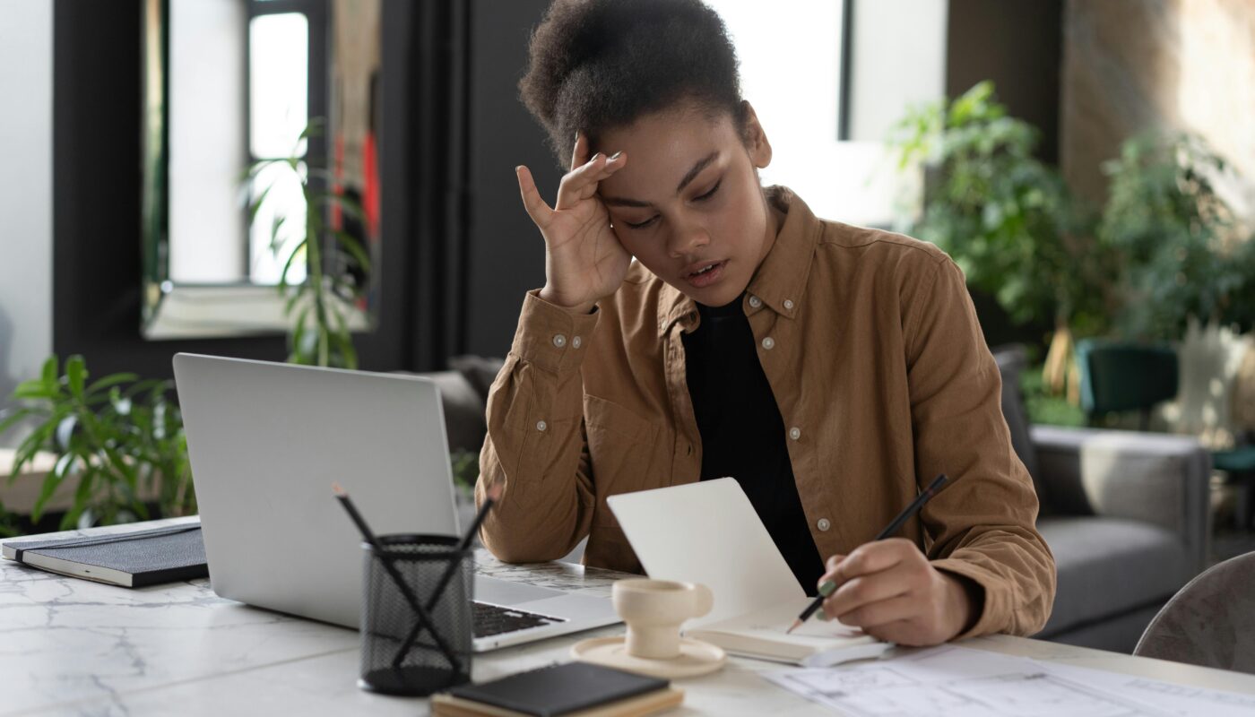 Photo by Mikhail Nilov: https://www.pexels.com/photo/a-woman-writing-on-a-notebook-6893827/