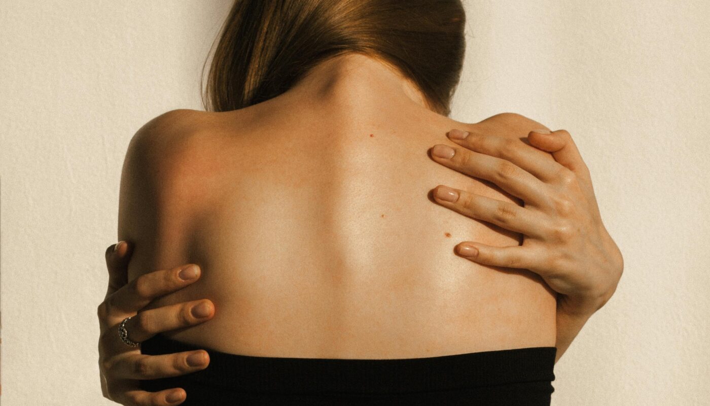 Photo by Nuta Sorokina: https://www.pexels.com/photo/back-view-of-a-woman-reaching-her-back-8467099/