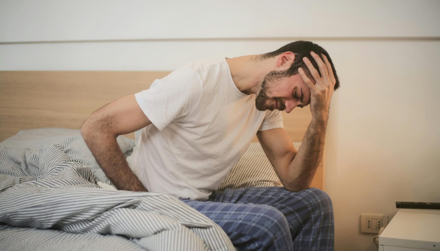 Photo by Andrea Piacquadio: https://www.pexels.com/photo/young-man-in-sleepwear-suffering-from-headache-in-morning-3771115/