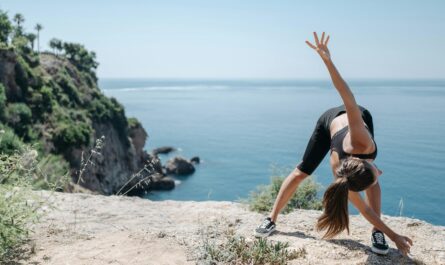 Photo by Pavel Danilyuk: https://www.pexels.com/photo/woman-in-black-sports-bra-doing-bending-and-stretching-exercise-on-mountain-cliff-8861031/