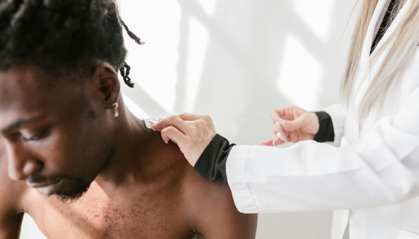 Photo by RDNE Stock project: https://www.pexels.com/photo/a-person-touching-a-man-shoulder-8312829/