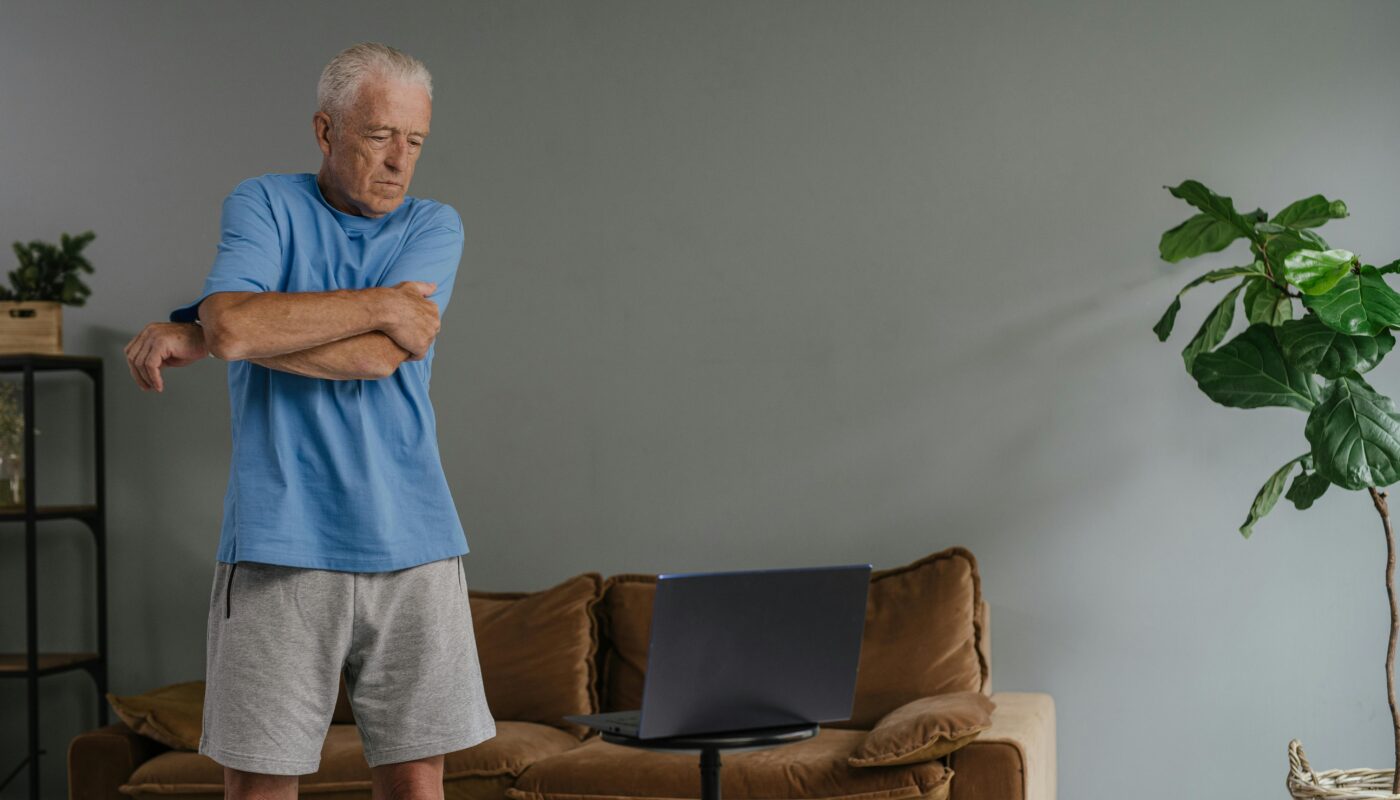Photo by SHVETS production: https://www.pexels.com/photo/a-man-in-blue-crew-neck-t-shirt-stretching-his-arms-8899522/