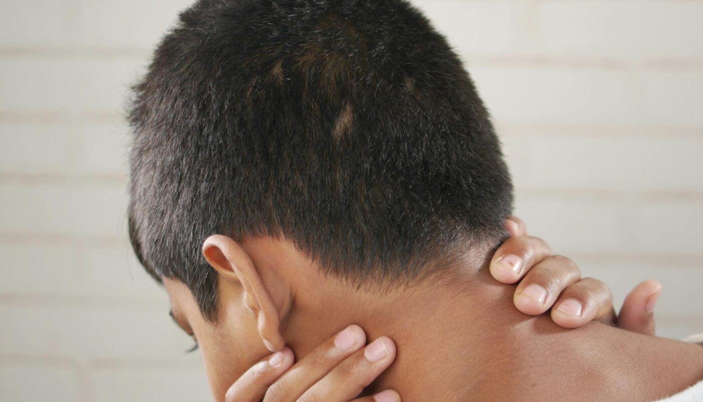 Photo by Towfiqu barbhuiya: https://www.pexels.com/photo/boy-in-white-shirt-holding-his-neck-13557587/