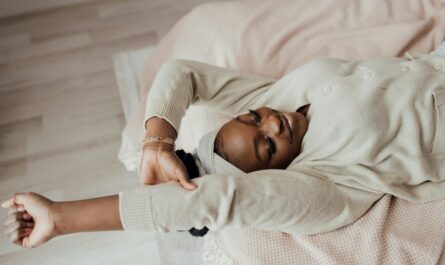 Photo by Arina Krasnikova: https://www.pexels.com/photo/a-woman-stretching-while-lying-in-bed-7005425/