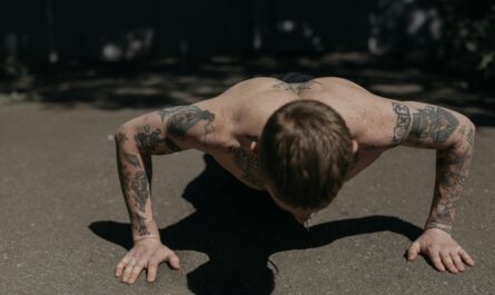 Photo by cottonbro studio: https://www.pexels.com/photo/a-shirtless-tattooed-man-doing-push-ups-on-the-concrete-floor-5320032/