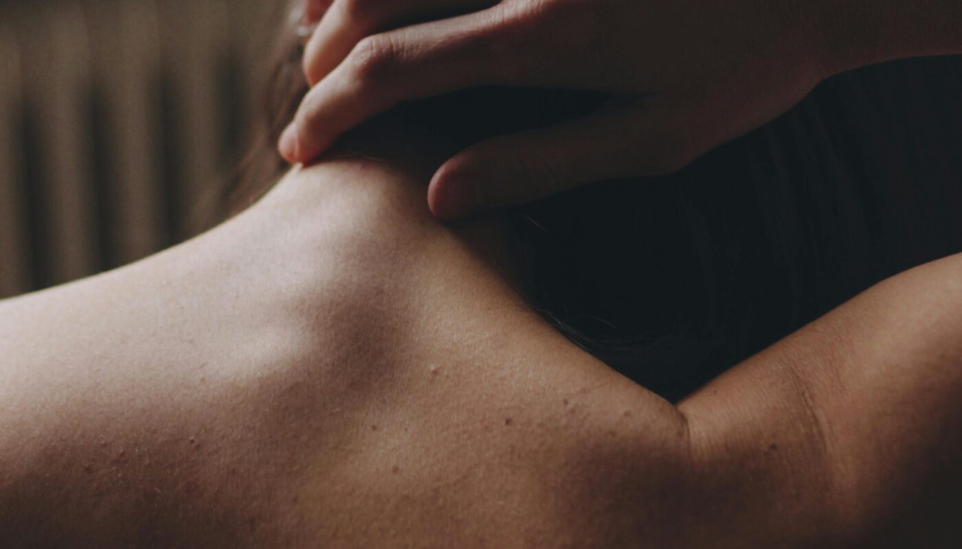 Photo by Margarita: https://www.pexels.com/photo/hand-on-neck-on-topless-body-15789874/