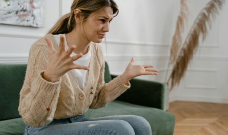 Photo by MART PRODUCTION: https://www.pexels.com/photo/a-sad-woman-sitting-on-a-sofa-7699356/