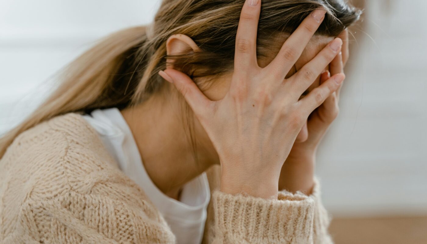 Photo by MART PRODUCTION: https://www.pexels.com/photo/woman-covering-her-face-with-her-hands-7699410/