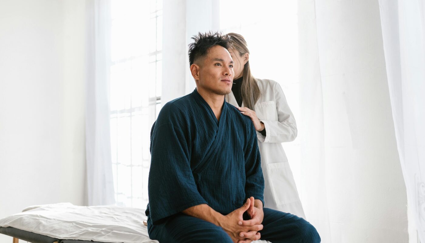 Photo by RDNE Stock project: https://www.pexels.com/photo/patient-sitting-and-doctor-standing-behind-8313219/