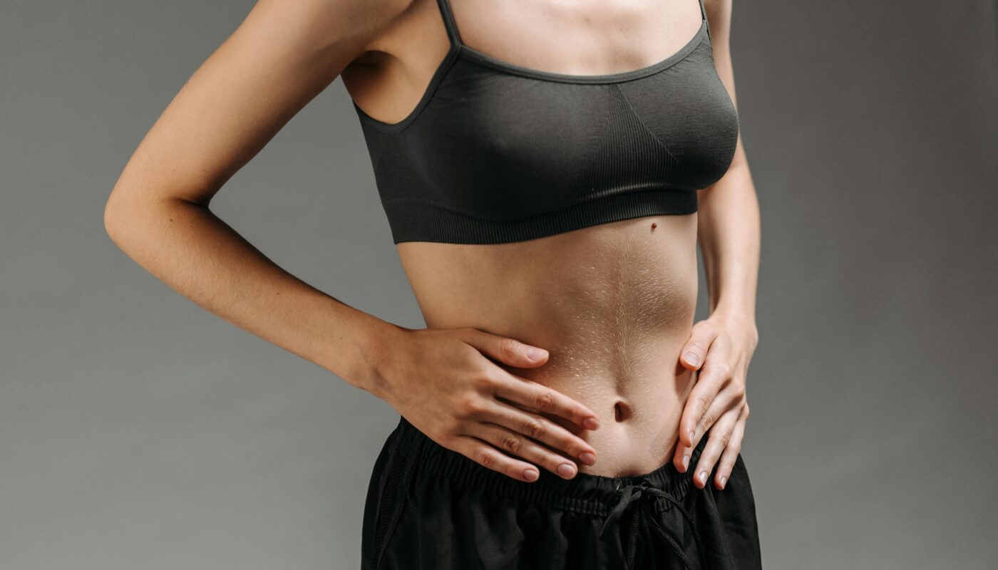 Photo by ROCKETMANN TEAM: https://www.pexels.com/photo/woman-in-black-sports-bra-and-black-skirt-9486598/