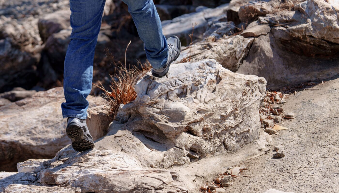 Photo by 水 金: https://www.pexels.com/photo/man-walking-on-stones-on-a-desert-20552877/