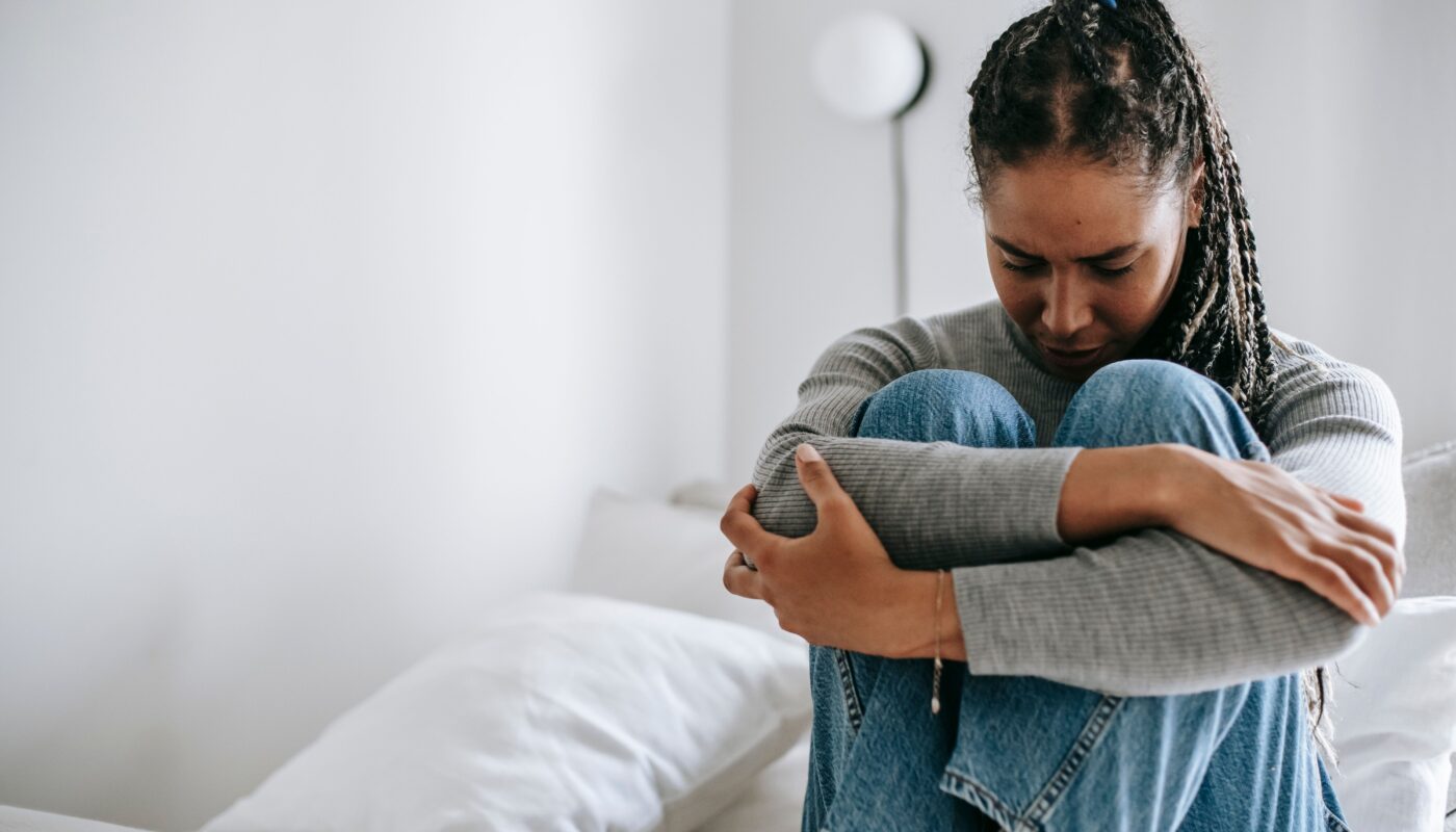 Photo by Alex Green: https://www.pexels.com/photo/upset-ethnic-woman-embracing-knees-on-bed-5699859/