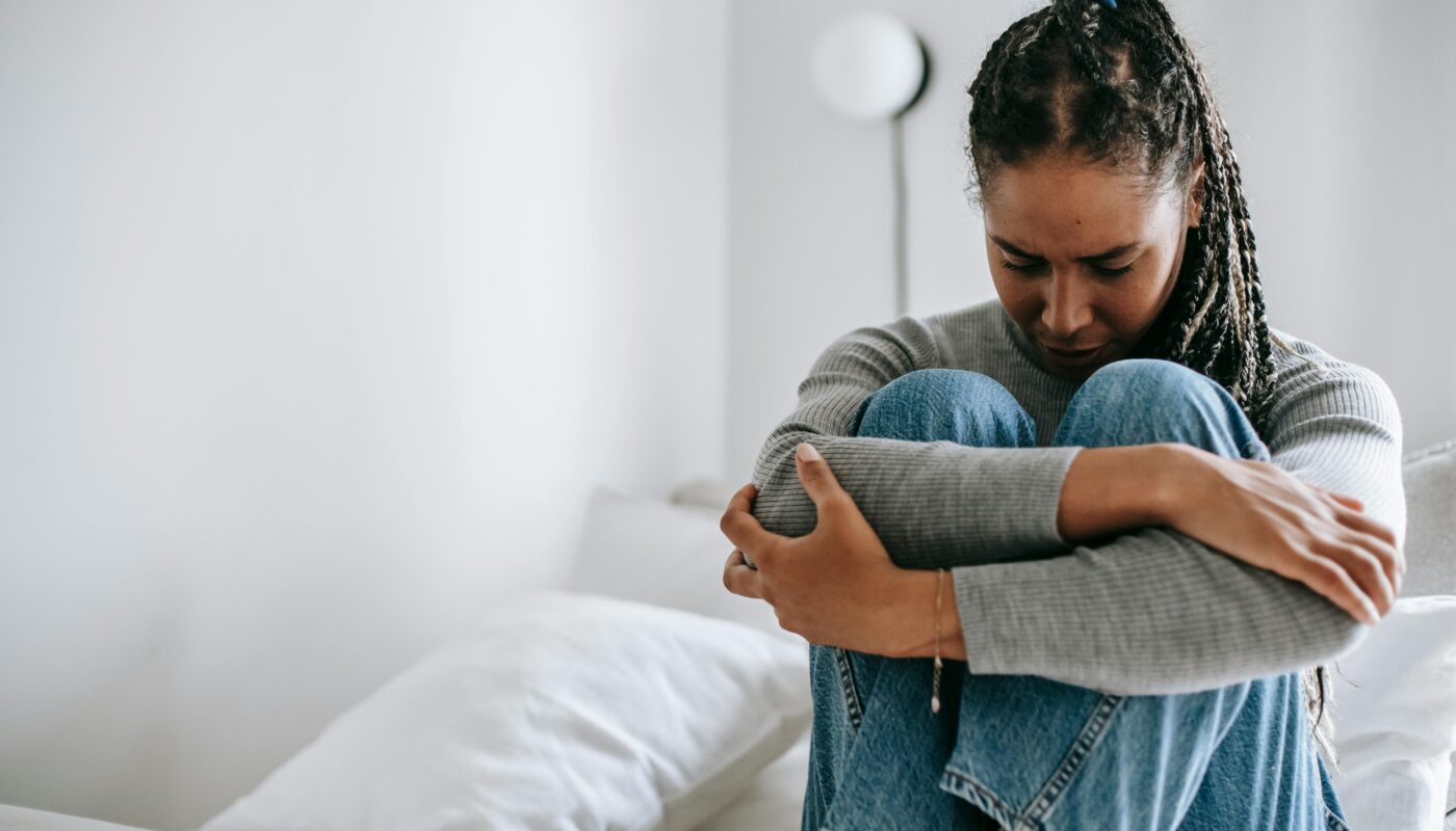 Photo by Alex Green: https://www.pexels.com/photo/upset-ethnic-woman-embracing-knees-on-bed-5699859/