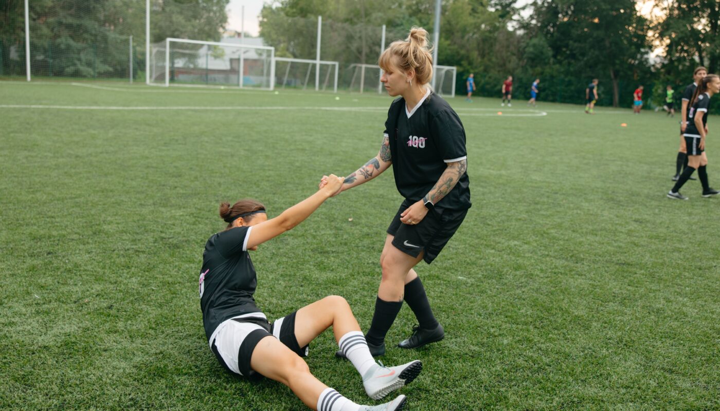 Photo by Anastasia Shuraeva: https://www.pexels.com/photo/a-tattooed-woman-helping-her-teammate-9517934/