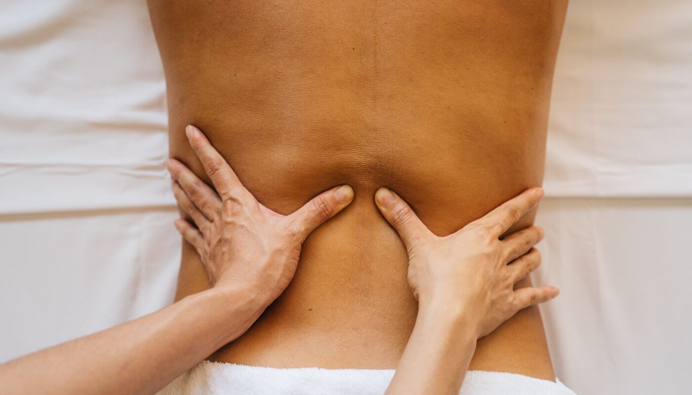 Photo by RDNE Stock project: https://www.pexels.com/photo/a-woman-putting-needles-in-the-back-of-a-man-8312847/
