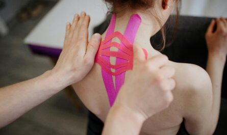Photo by Danik Prihodko: https://www.pexels.com/photo/close-up-of-person-taping-client-back-8219057/